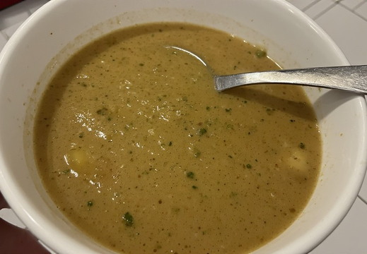 A vegetable-based soup with broccoli.