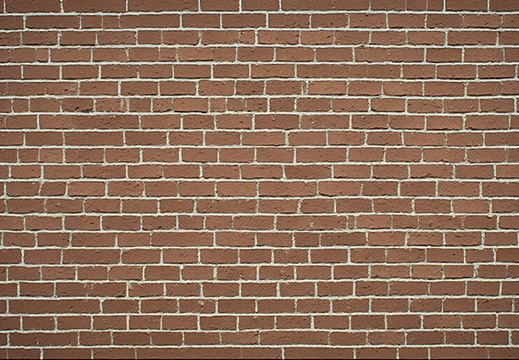 A full frame, eye-level shot of a brick wall