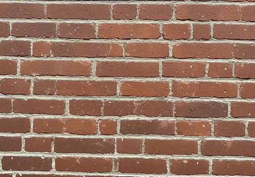 Full-frame view of a brick wall with reddish-brown bricks