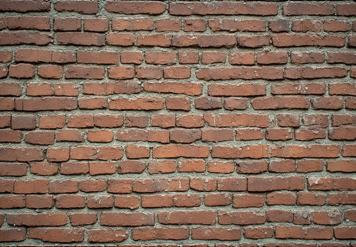 An old, weathered brick wall