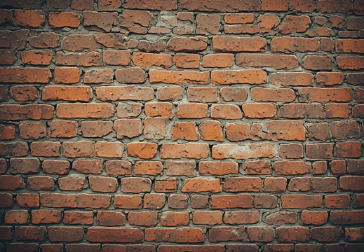 Head-on view of a weathered brick wall