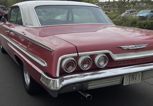 The rear passenger side of a vintage two-door coupe
